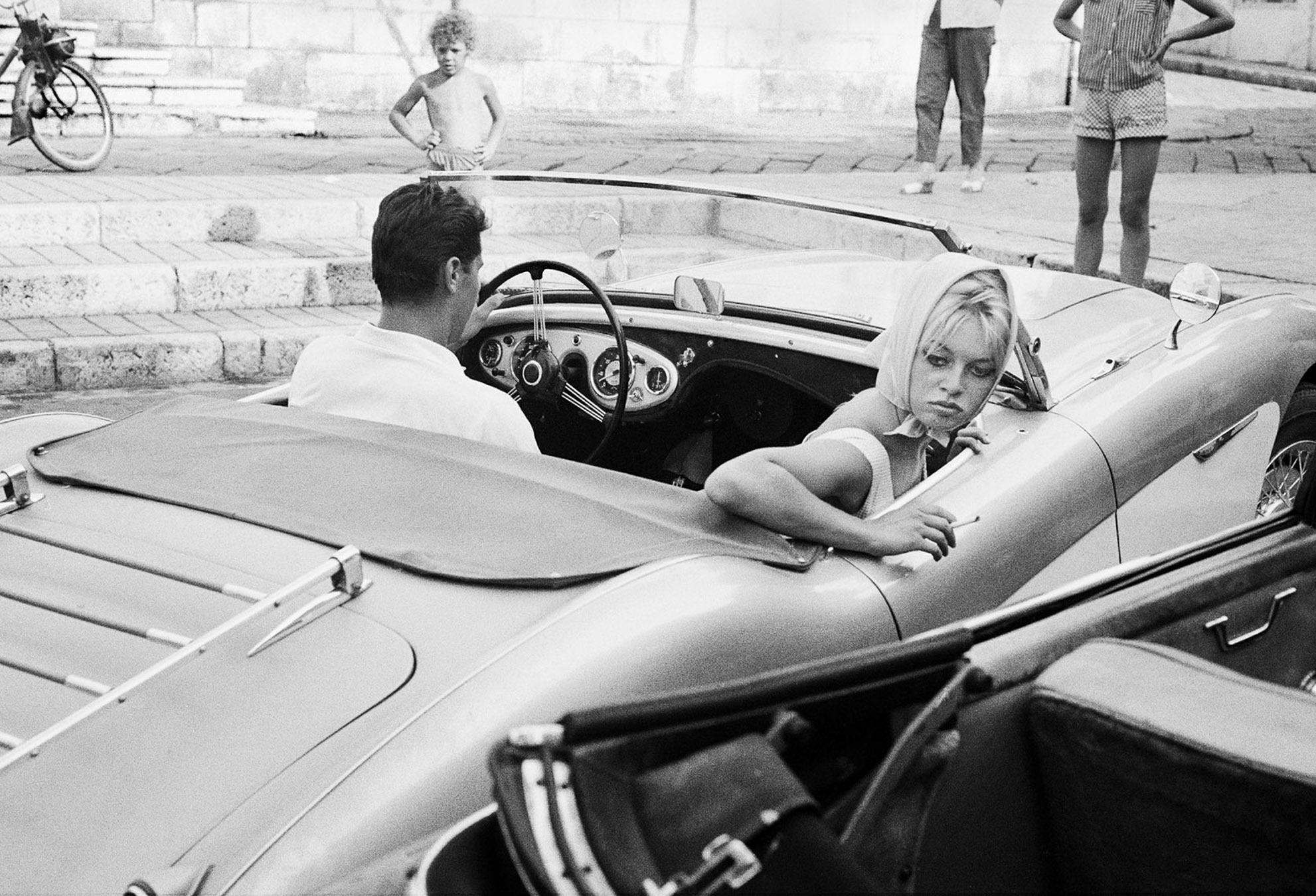 Brigitte Bardot and Sacha Distel going to assist the wedding of jazz musician Moustache, Antibes 1958 40x50cm, Also available: 82x113cm, Edition of 5